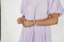 Load image into Gallery viewer, White and Clear Acrylic Bracelet with Gold Accents
